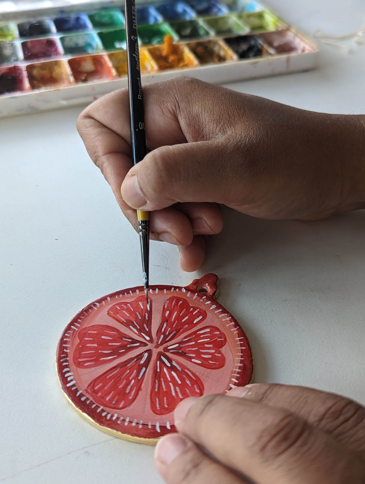 A Candied Orange ornament – (end of line) hand painted bauble