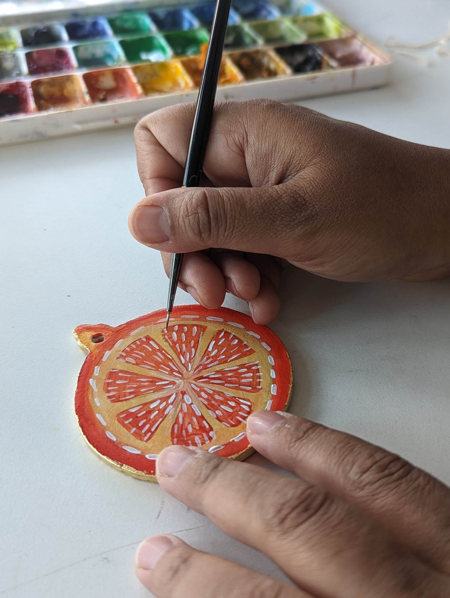A Candied Orange ornament – (end of line) hand painted bauble