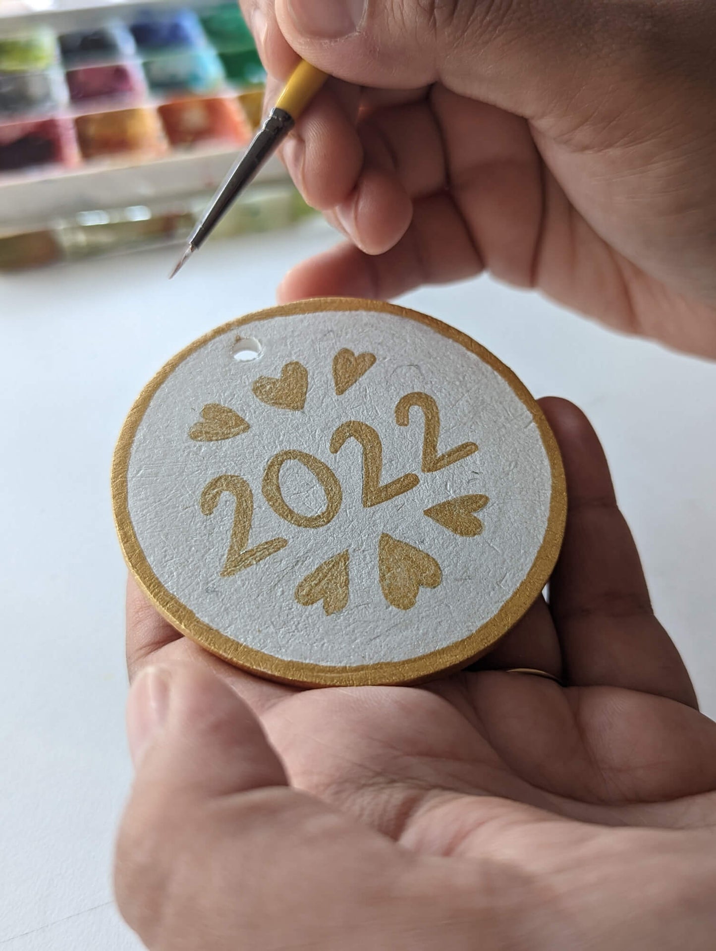 A First Christmas ornament – hand painted bauble