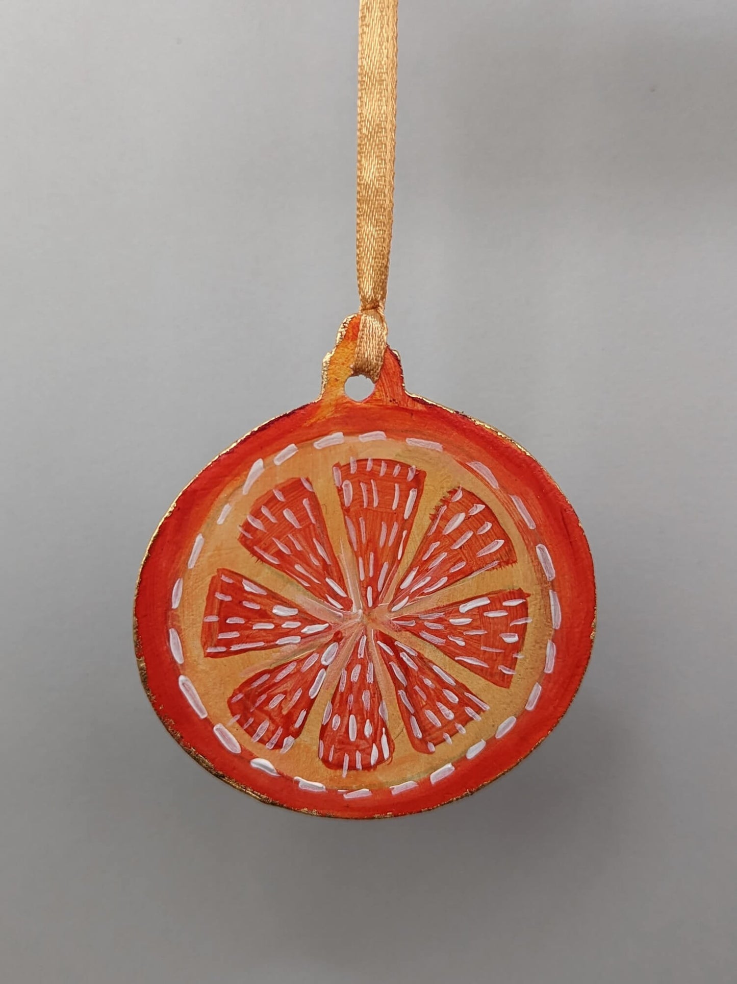 A Candied Orange ornament – (end of line) hand painted bauble