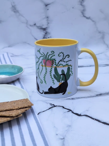 Plant Kitties (black cats, yellow accents) – ceramic mug