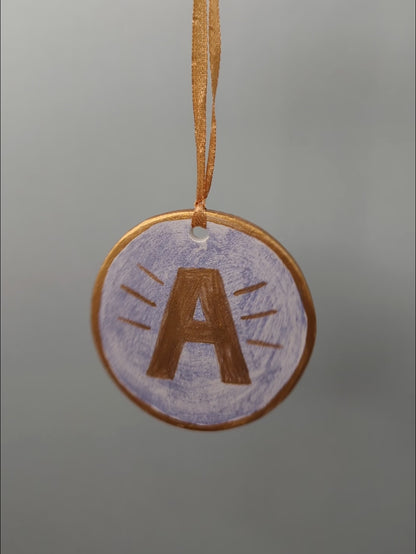 A First Christmas ornament – hand painted bauble